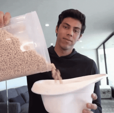 Young Man Pouring Cereal GIF