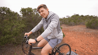 Young Man Riding Bike On Dirt Path GIF
