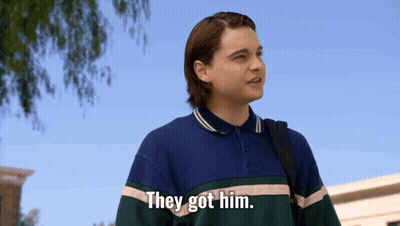 Young Man Saying They Got Him Holding Backpack GIF