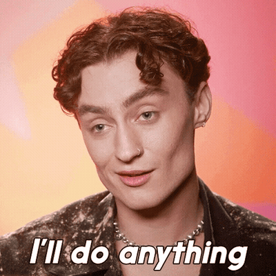 Young Man Says I'll Do Anything Pink Background GIF