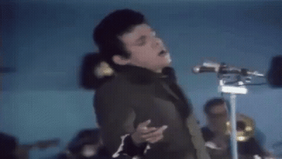 Young Man Singing Into Microphone GIF