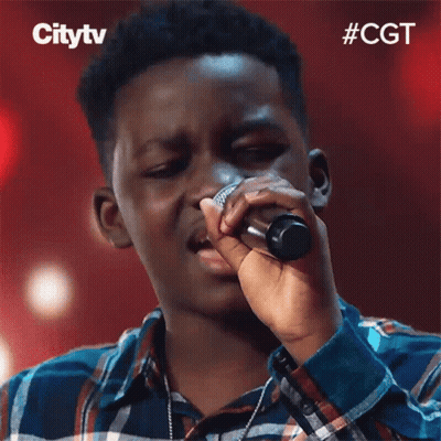 Young Man Singing Into Microphone GIF