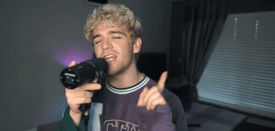 Young Man Singing Into Microphone CF Shirt GIF