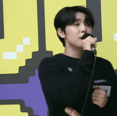 Young Man Singing Into Microphone GIF