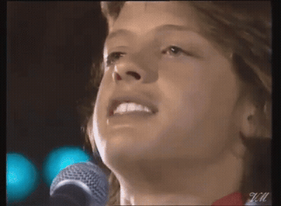 Young Man Singing Into Microphone GIF