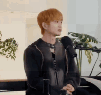 Young Man Sitting At Microphone GIF
