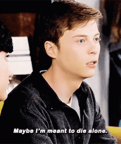 Young Man Sitting At Table Talking To Another Man GIF