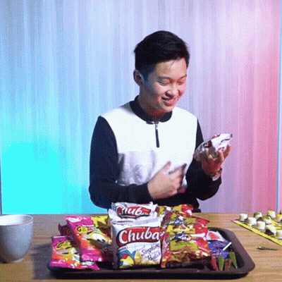 Young Man Sitting At Table With Chuba Snacks Saying Wow GIF