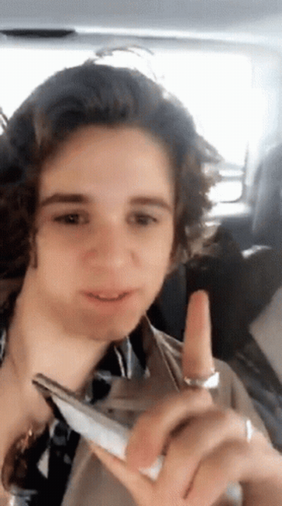 Young Man Sitting In Car Holding Phone GIF