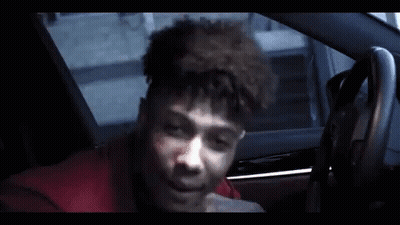 Young Man Sitting In Car Talking On Cell Phone GIF