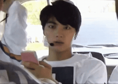 Young Man Sitting In Car Using Cell Phone GIF