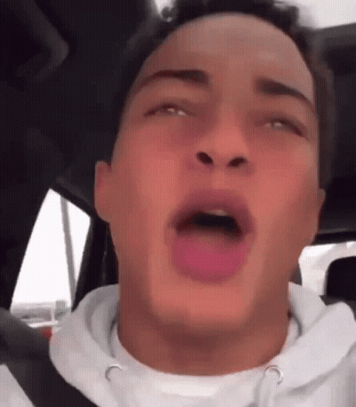 Young Man Sitting In Car With Tongue Hanging Out GIF