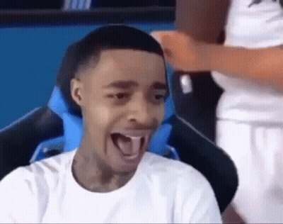 Young Man Sitting In Chair With Tongue Out GIF