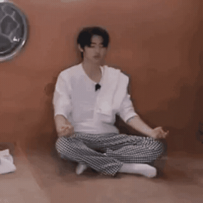 Young Man Sitting In Lotus Position GIF