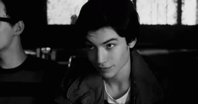 Young Man Sitting In Restaurant GIF