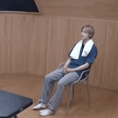 Young Man Sitting On Chair With Towel GIF