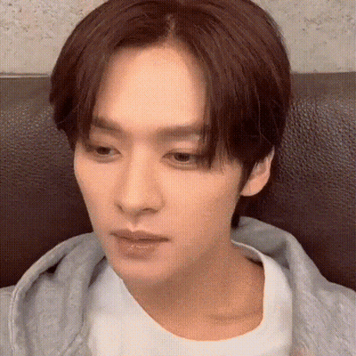 Young Man Sitting On Couch Eyes Closed GIF