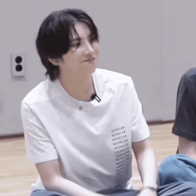 Young Man Sitting On Floor Smiling GIF