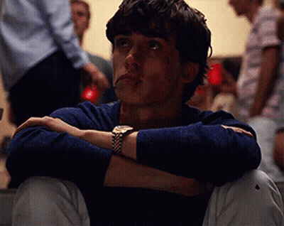 Young Man Sitting With Arms Crossed GIF