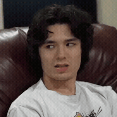 Young Man Sitting With Eyes Closed GIF