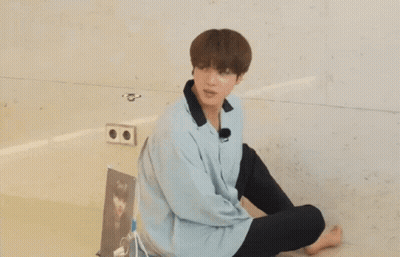 Young Man Sitting With Question Mark GIF