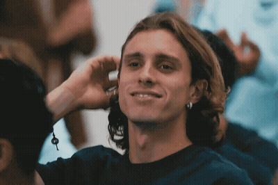 Young Man Smiling Covering Ear GIF