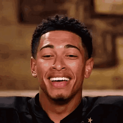 Young Man Smiling Eyes Closed Mouth Open Black Star Shirt GIF