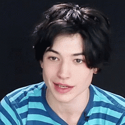 Young Man Smiling In Blue And White Striped Shirt GIF