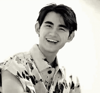 Young Man Smiling In Camouflage Jacket GIF