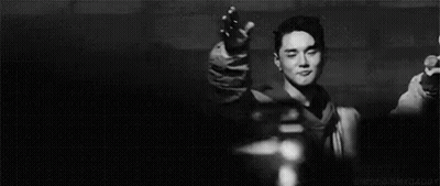 Young Man Smiling In Dark Room GIF