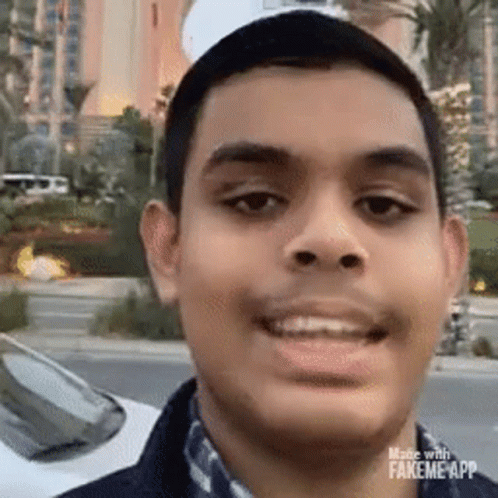 Young Man Smiling In Front Of Car GIF