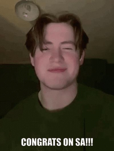 Young Man Smiling In Green Shirt GIF