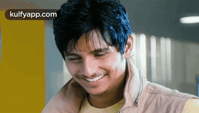 Young Man Smiling In Jacket GIF