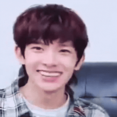 Young Man Smiling In Plaid And White Shirt GIF