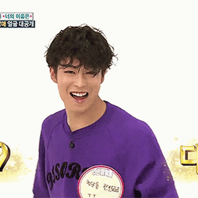Young Man Smiling In Purple Shirt GIF