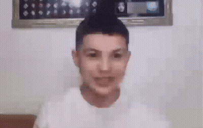 Young Man Smiling In White T-Shirt GIF