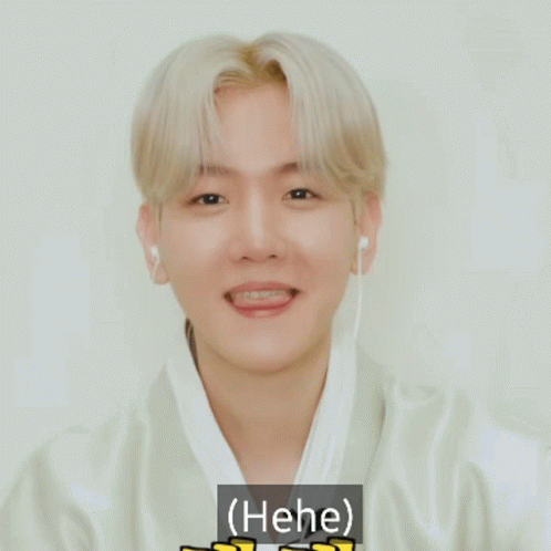 Young Man Smiling With Ear Buds Saying Hee GIF