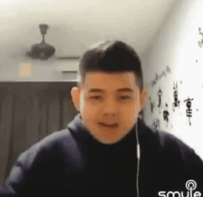 Young Man Smiling With Headphones GIF