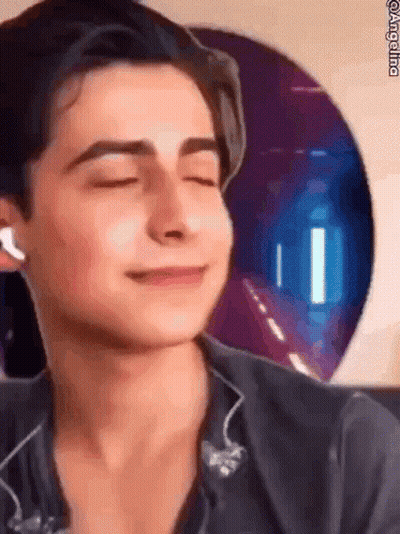 Young Man Smiling With Headphones GIF