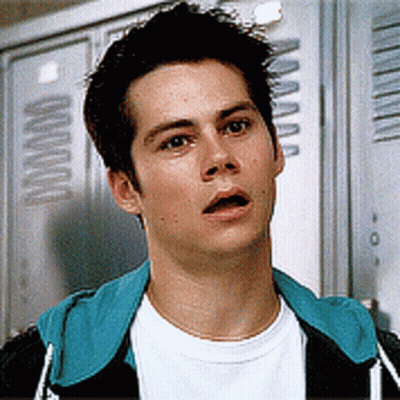 Young Man Standing In Front Of Lockers With Letter A GIF