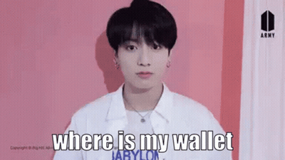 Young Man Standing In Front Of Pink Wall GIF