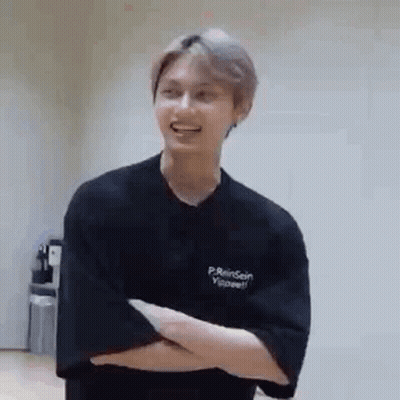 Young Man Standing With Crossed Arms GIF