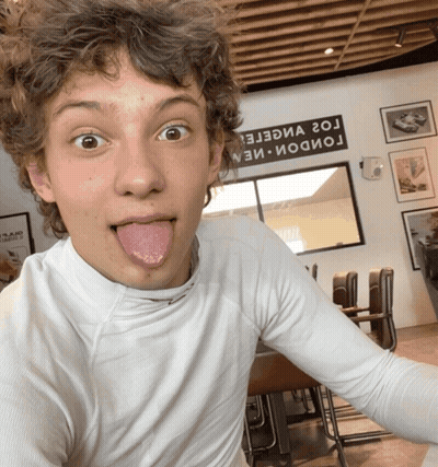 Young Man Sticking Tongue Out G2 Sign GIF