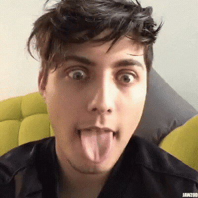 Young Man Sticking Tongue Out Making Funny Face