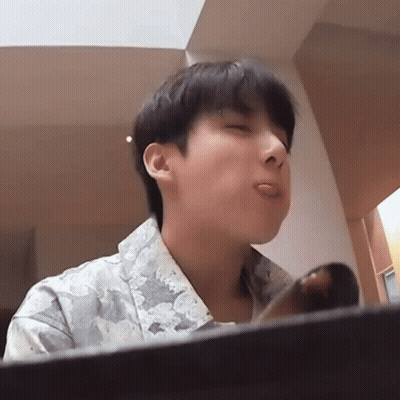 Young Man Sticking Tongue Out With Eyes Closed GIF
