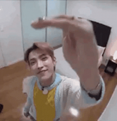 Young Man Taking Selfie In Bedroom GIF