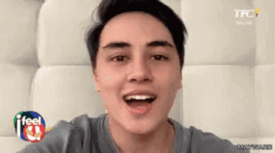 Young Man Taking Selfie With Mouth Open And TFC Logo GIF