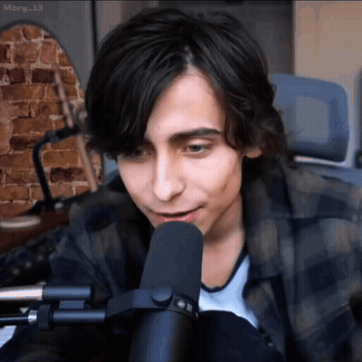 Young Man Talking Into Microphone GIF