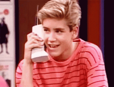 Young Man Talking On Cell Phone Smiling GIF