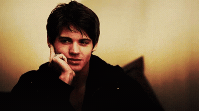 Young Man Talking On Cell Phone GIF
